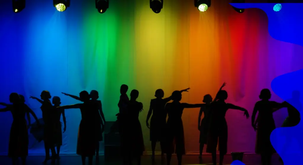 People dancing against a colorful background to represent the cross-cutting aspects of European design