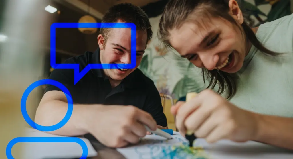 Two young people are collaborating on a creative project, an example of inclusive European design based on participation, accessibility, and sharing
