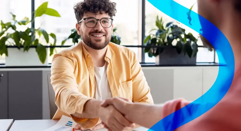 A young person shakes hands during a job interview; the topic is active labor market policies